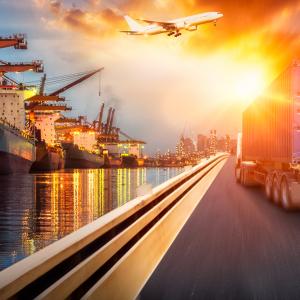 Composite Cranes, Ships, Water, Road, Trucks, Orange Sky AdobeStock_258838496.jpeg